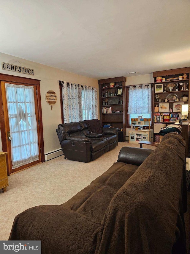 carpeted living room with baseboard heating