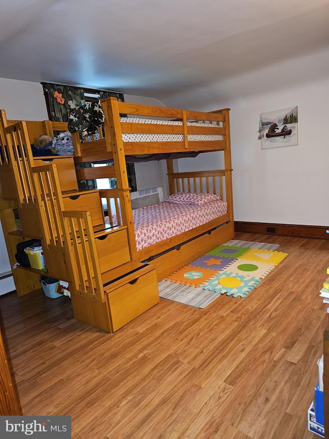 bedroom with hardwood / wood-style floors