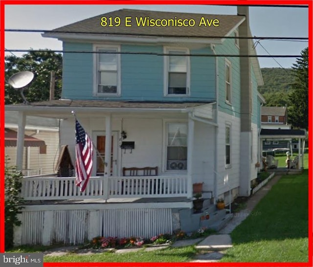 view of front of property featuring covered porch