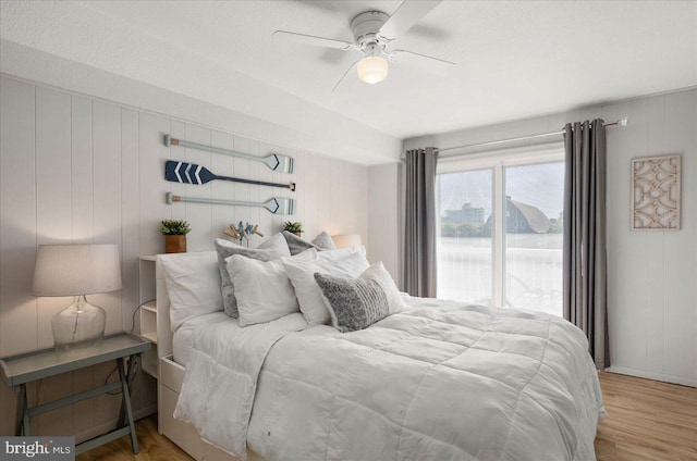 bedroom featuring light hardwood / wood-style floors and ceiling fan