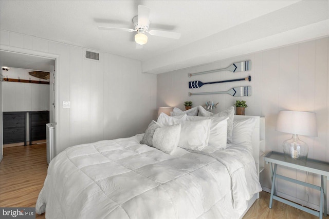 bedroom with ceiling fan and hardwood / wood-style floors