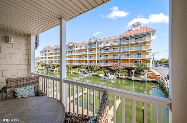 balcony featuring a water view