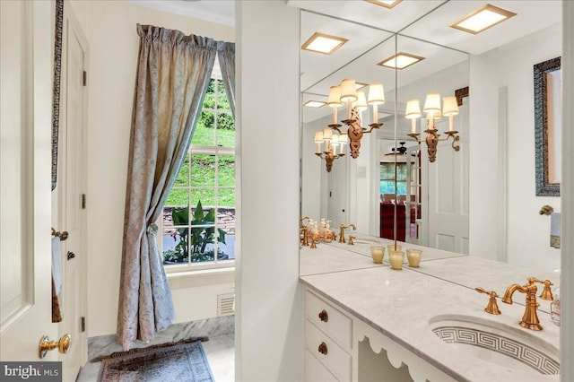 bathroom featuring visible vents and vanity