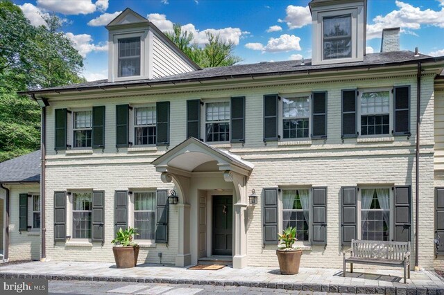 colonial house with a lawn