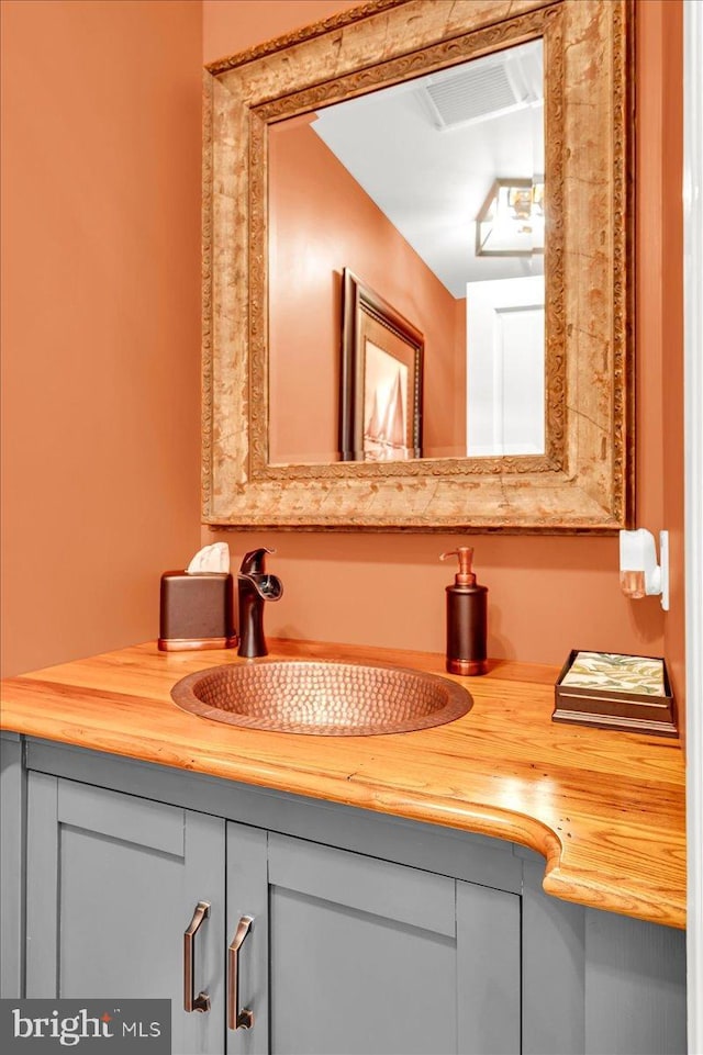 bathroom featuring visible vents and vanity