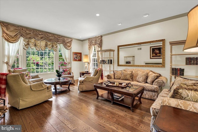 living room featuring recessed lighting, crown molding, and wood finished floors