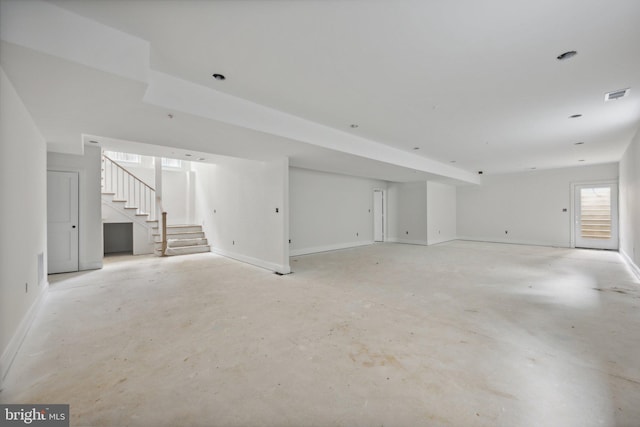 interior space with visible vents, baseboards, and stairs