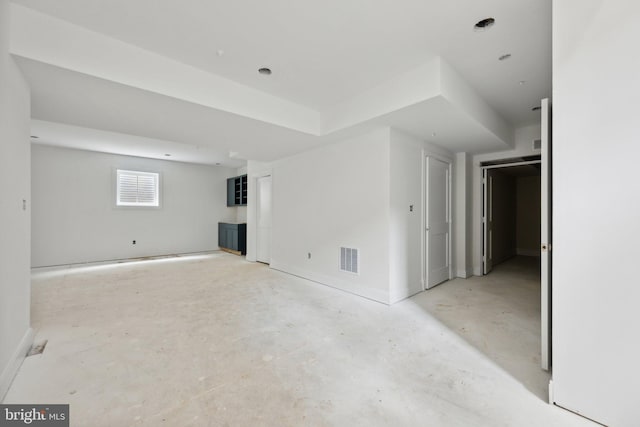 unfurnished room featuring baseboards and visible vents