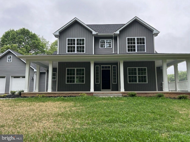 farmhouse featuring a porch and a front yard