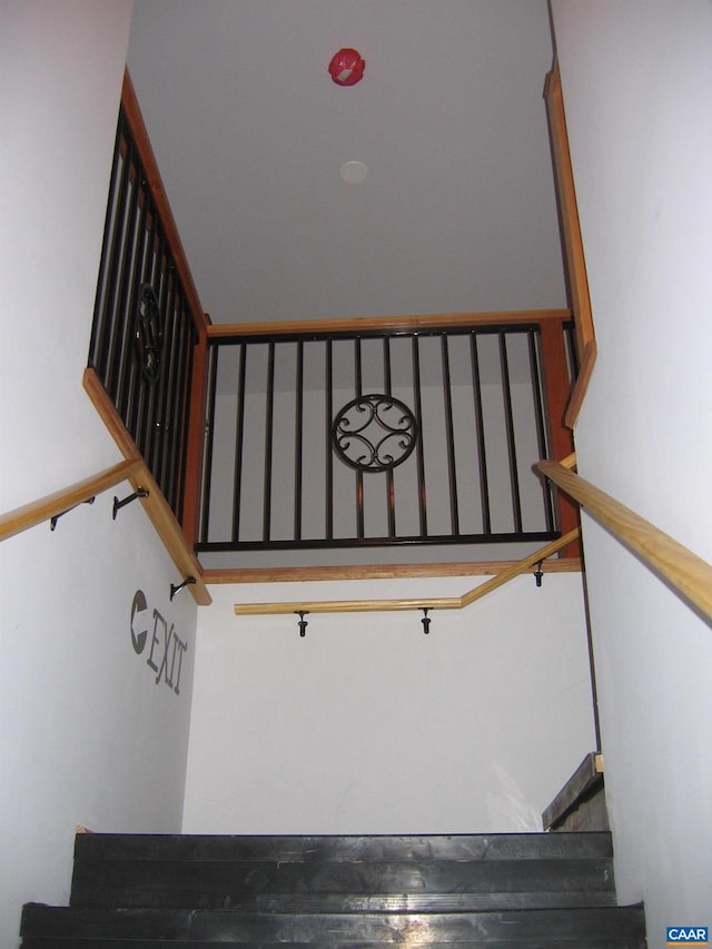 staircase with a high ceiling