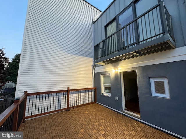 view of side of property with a balcony