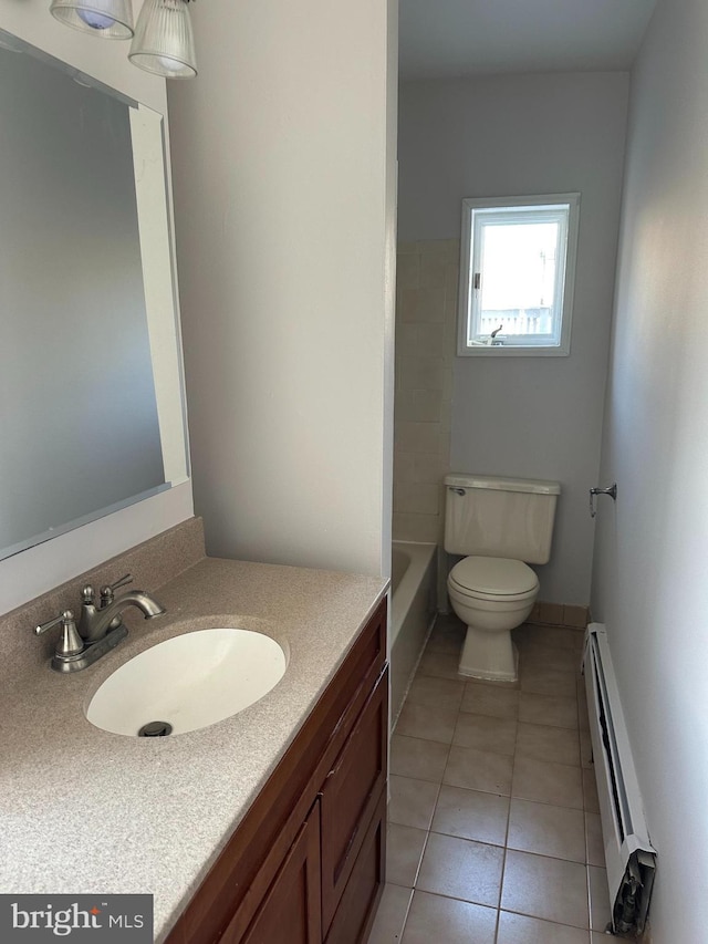 full bathroom with tile patterned flooring, toilet, vanity, and baseboard heating