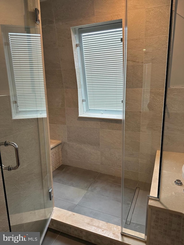 bathroom with a shower stall