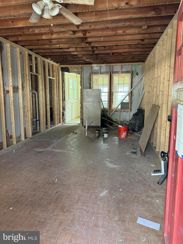 basement with ceiling fan