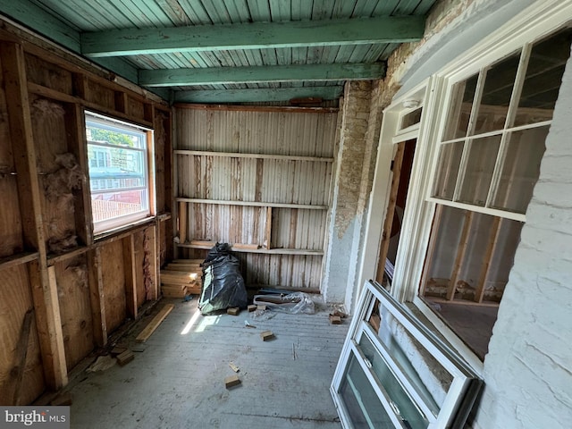 interior space featuring beam ceiling