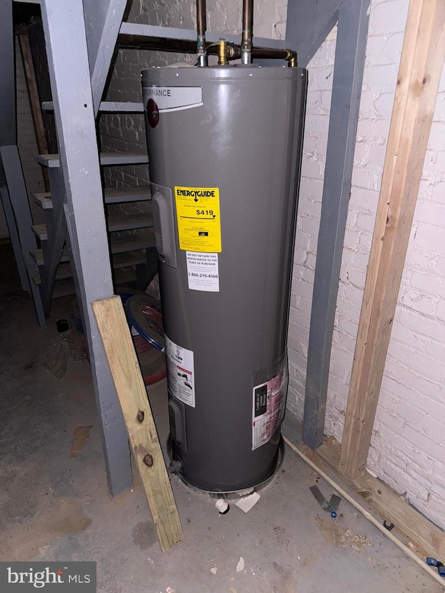 utility room with electric water heater