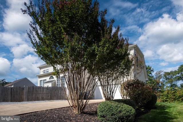 view of property exterior featuring a garage