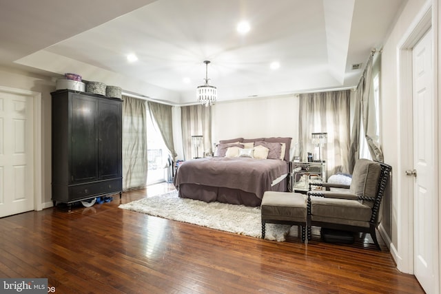 bedroom featuring recessed lighting, a notable chandelier, dark wood-type flooring, visible vents, and baseboards