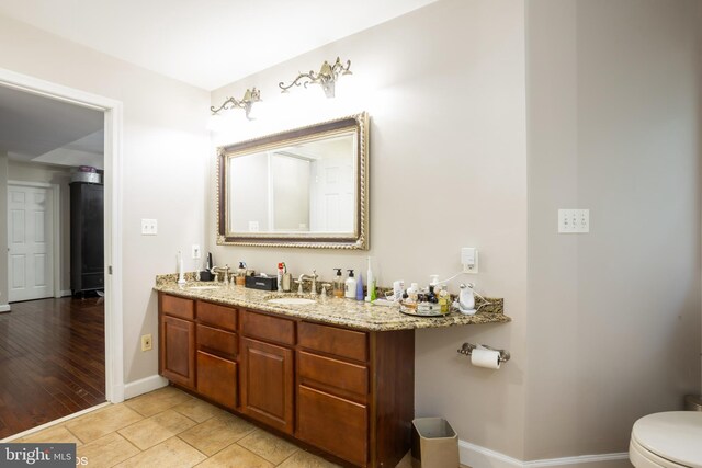 bathroom with tile patterned flooring, a shower with shower door, and vanity