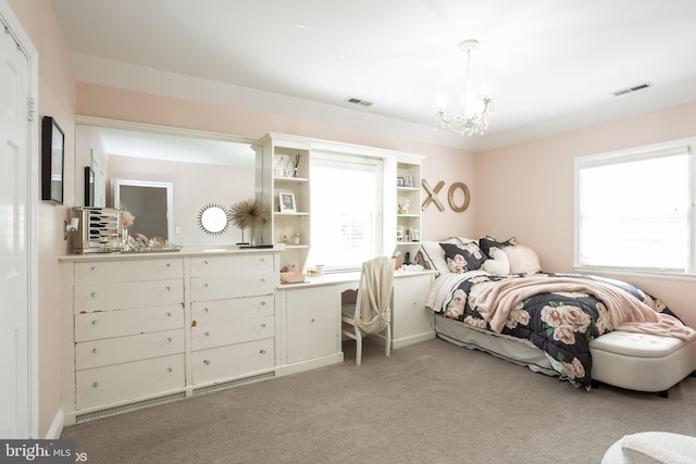 bedroom featuring light carpet, multiple windows, and visible vents