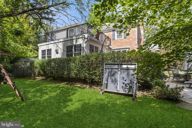 rear view of house with a balcony and a deck