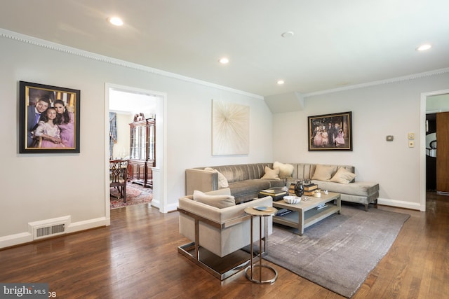 living room featuring dark wood-type flooring and ornamental molding