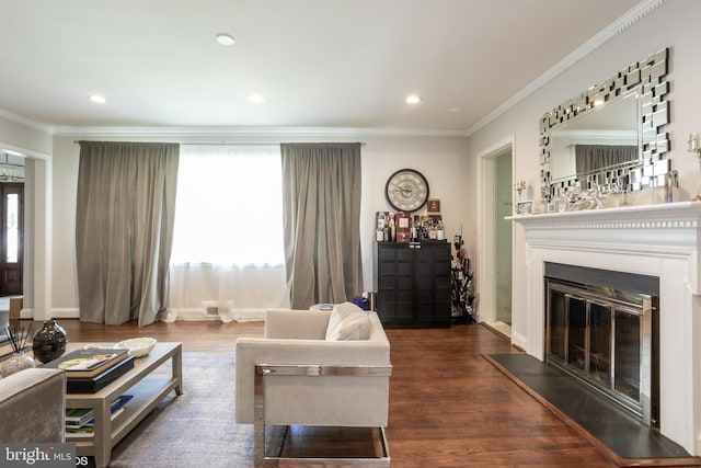 living room featuring hardwood / wood-style flooring and crown molding