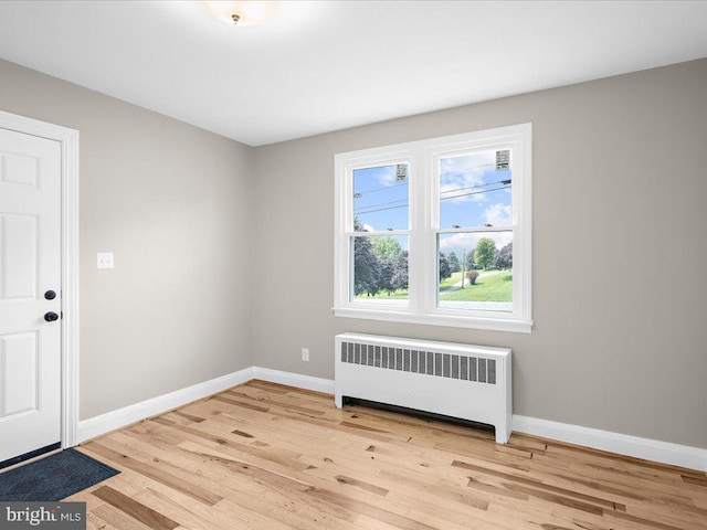 2731 Old Washington Rd, Westminster, MD 21157 - empty room featuring radiator heating unit, baseboards, and wood finished floors