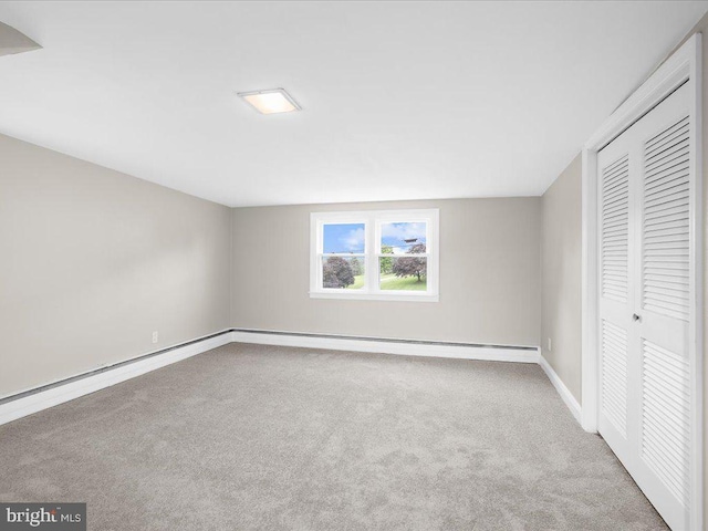 2731 Old Washington Rd, Westminster, MD 21157 - unfurnished bedroom featuring a baseboard heating unit, carpet, a closet, and baseboards