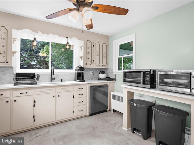 2731 Old Washington Rd, Westminster, MD 21157 - kitchen with a sink, black dishwasher, light countertops, decorative backsplash, and stainless steel microwave
