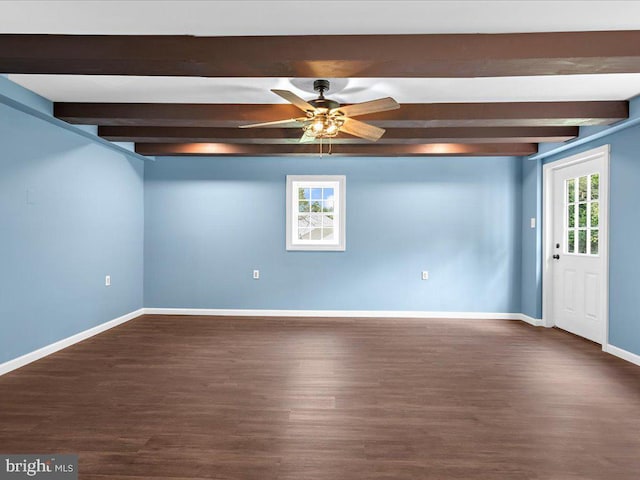 basement featuring ceiling fan and dark hardwood / wood-style floors