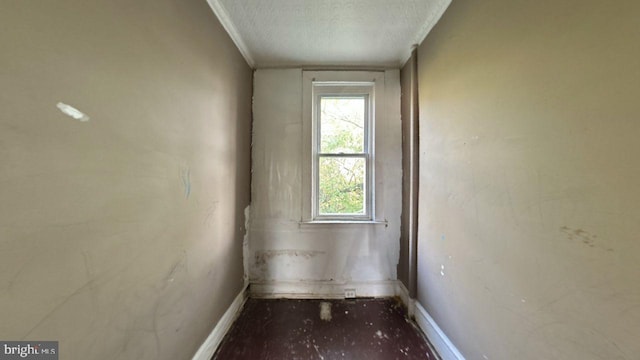 spare room with a wealth of natural light and a textured ceiling