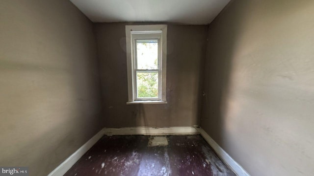 spare room with wood-type flooring