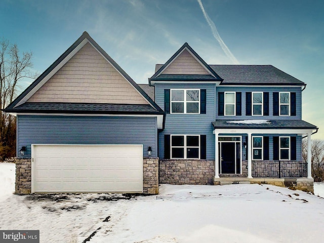 craftsman-style home with covered porch and a garage