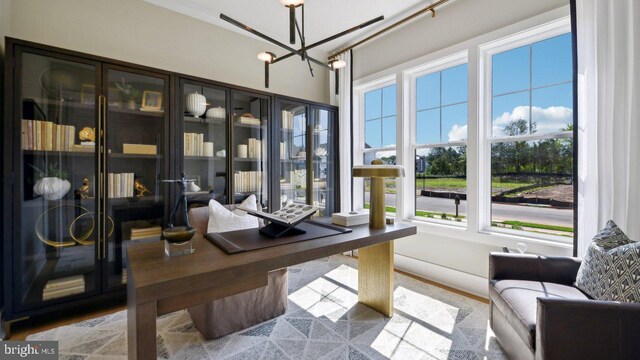 home office featuring a notable chandelier