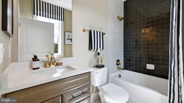 full bathroom featuring vanity, toilet, and shower / bath combo with shower curtain