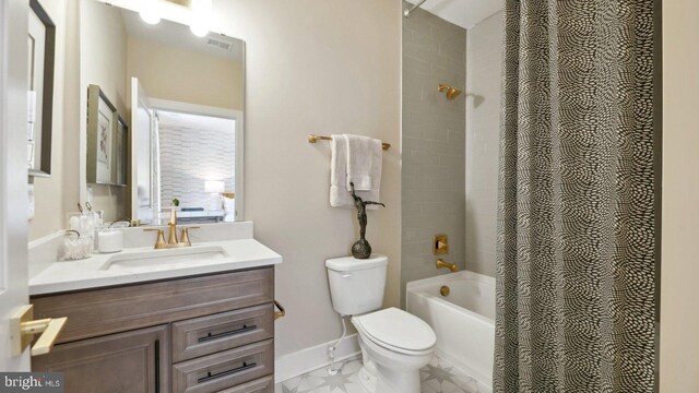 full bathroom with toilet, shower / tub combo with curtain, and vanity