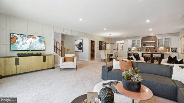 living room featuring light colored carpet