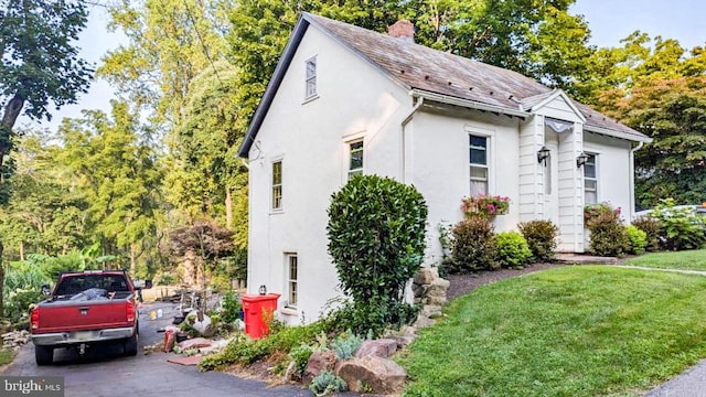 view of home's exterior featuring a lawn