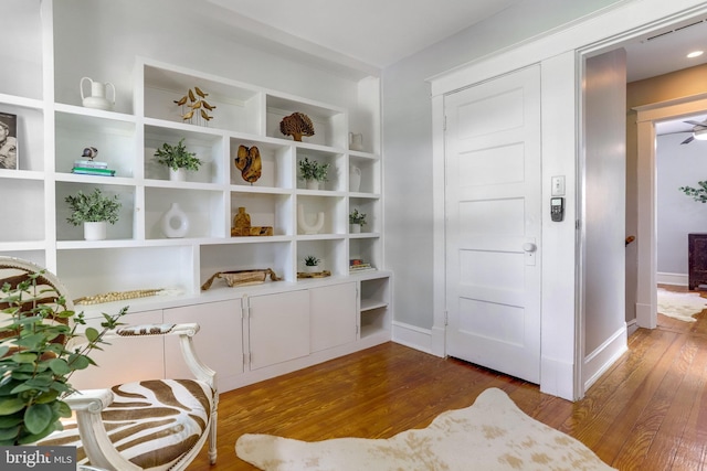 sitting room with hardwood / wood-style flooring