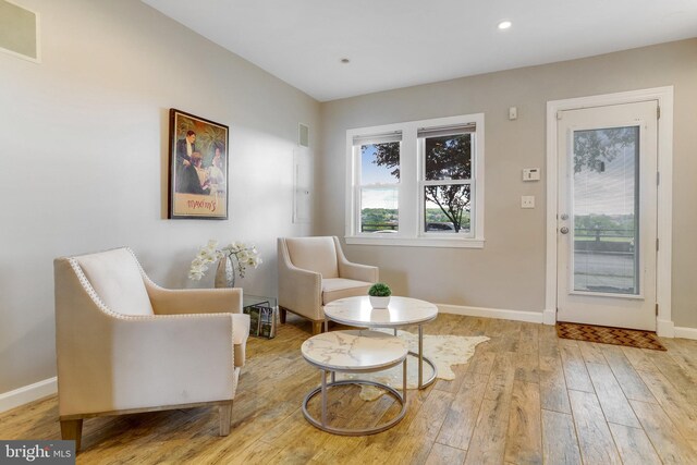 sitting room featuring light hardwood / wood-style flooring