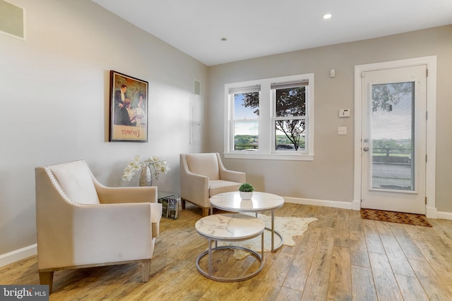 sitting room featuring recessed lighting, visible vents, baseboards, and wood finished floors