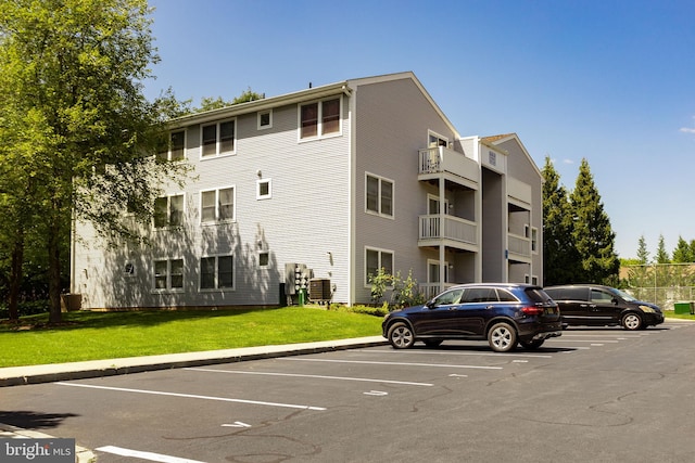 view of building exterior with central air condition unit