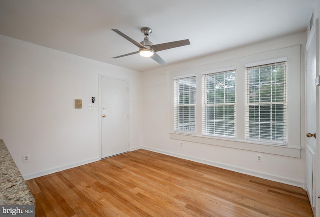 empty room featuring ceiling fan and wood-type flooring