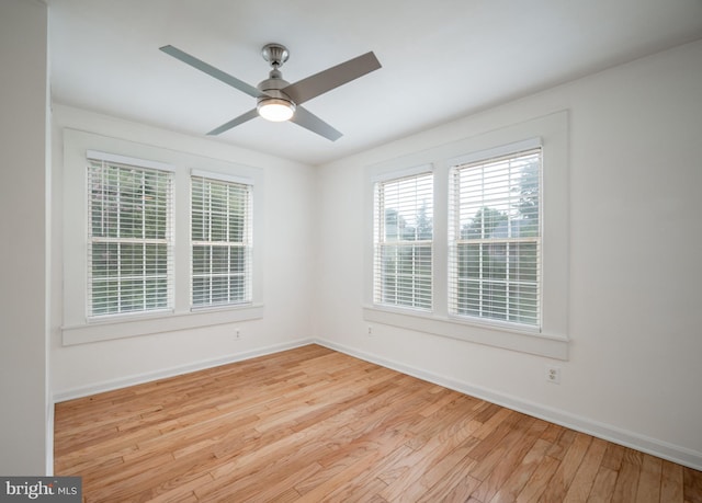 empty room featuring ceiling fan and light hardwood / wood-style floors