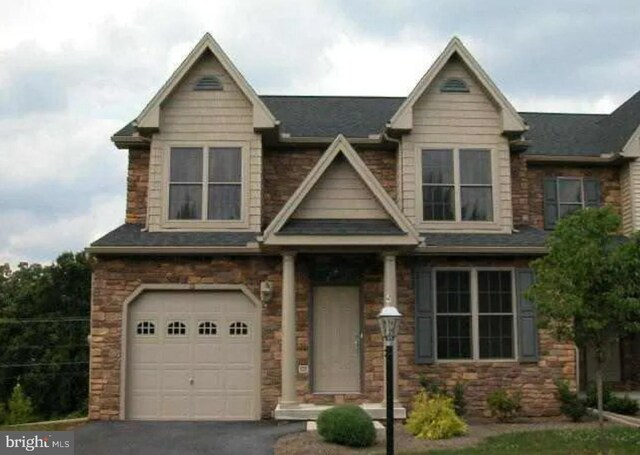 craftsman-style house featuring a garage