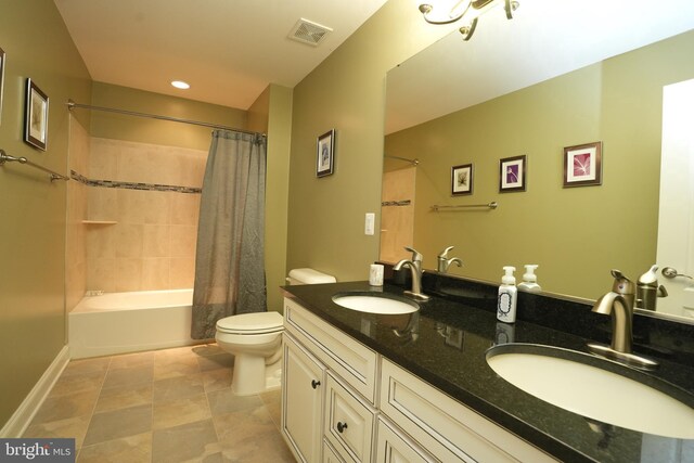 full bath with toilet, shower / tub combo, a sink, and visible vents