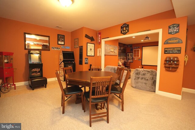 dining room with carpet and baseboards