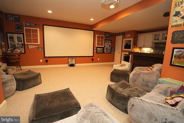 home theater featuring light carpet, baseboards, and recessed lighting