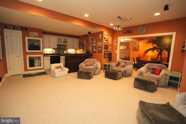 living room with light carpet and recessed lighting